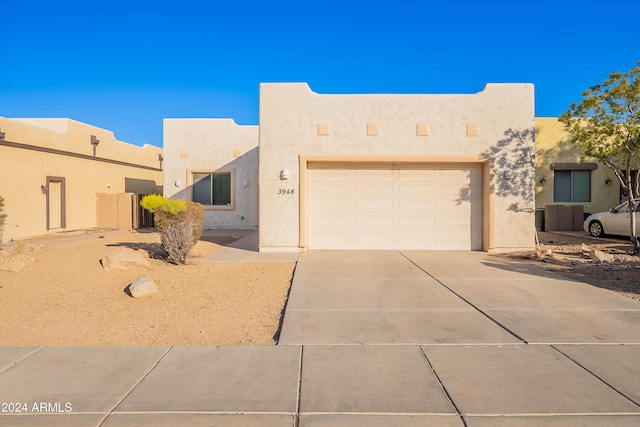 adobe home featuring a garage