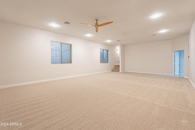 carpeted empty room with ceiling fan