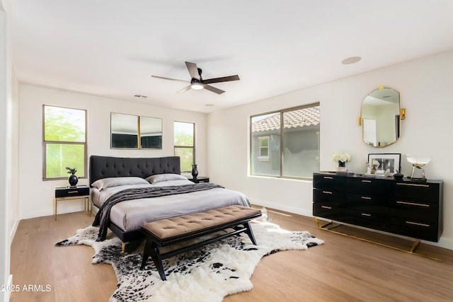 11891 N 147th Dr, Surprise, AZ 85379 - bedroom featuring ceiling fan, baseboards, light wood-type flooring, and visible vents
