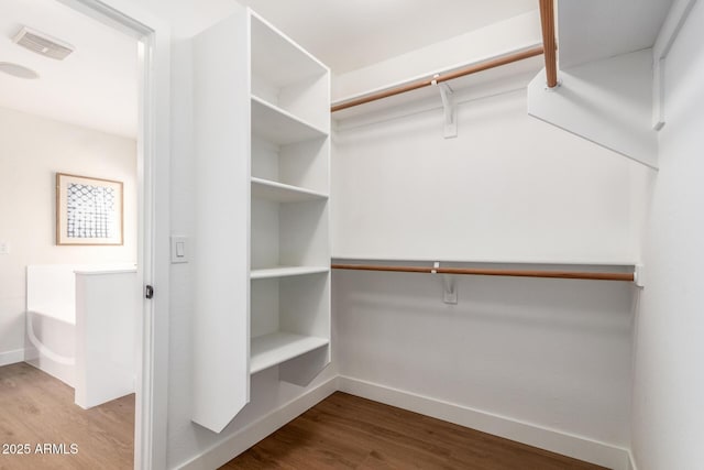 11891 N 147th Dr, Surprise, AZ 85379 - walk in closet with visible vents and wood finished floors