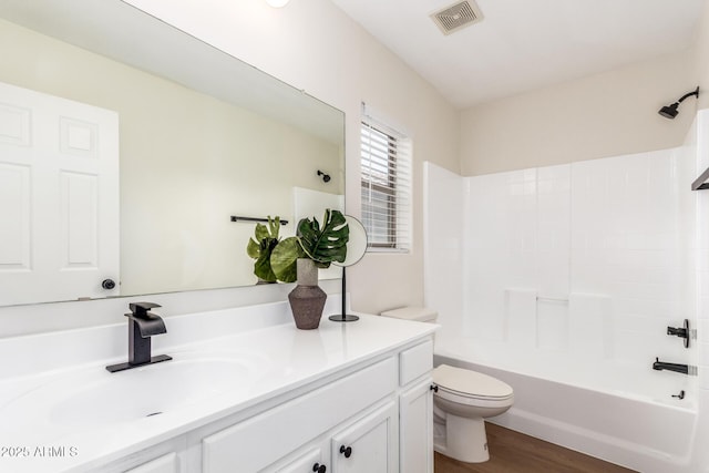 11891 N 147th Dr, Surprise, AZ 85379 - full bath with shower / bathtub combination, toilet, visible vents, vanity, and wood finished floors