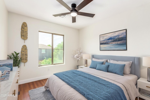11891 N 147th Dr, Surprise, AZ 85379 - bedroom featuring wood finished floors, visible vents, baseboards, and a ceiling fan