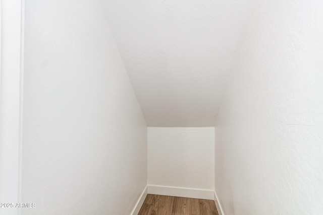 11891 N 147th Dr, Surprise, AZ 85379 - interior space featuring lofted ceiling, baseboards, and wood finished floors