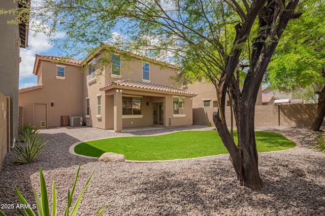 11891 N 147th Dr, Surprise, AZ 85379 - back of property featuring central AC, a patio area, stucco siding, a tile roof, and a fenced backyard