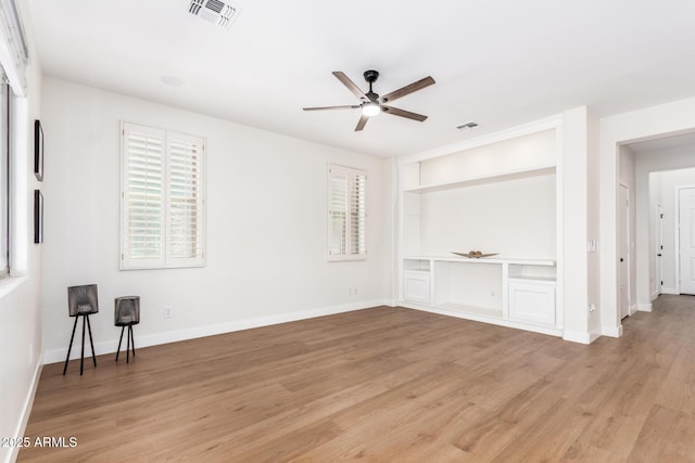 11891 N 147th Dr, Surprise, AZ 85379 - interior space featuring light wood finished floors, visible vents, and baseboards