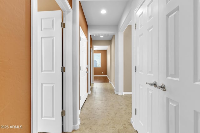 corridor featuring baseboards