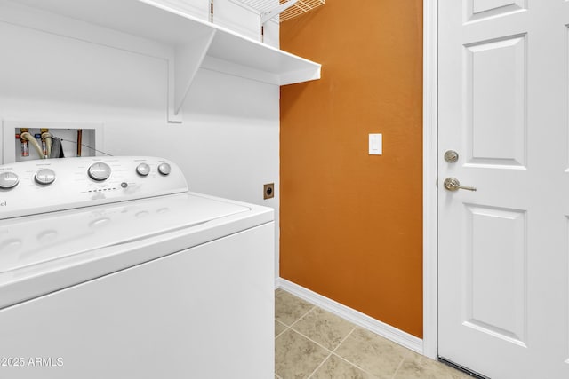 laundry room with laundry area, light tile patterned flooring, washer / dryer, and baseboards