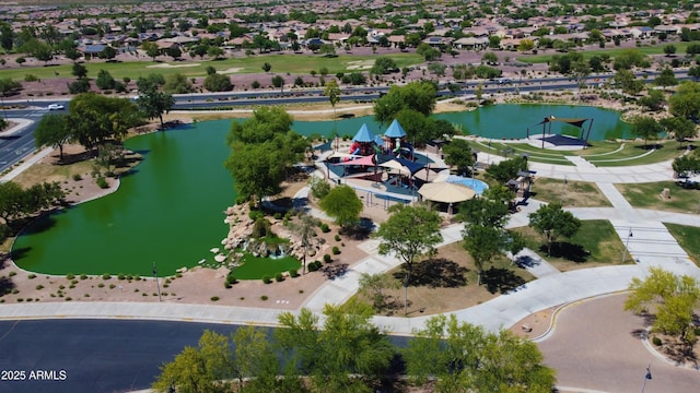 birds eye view of property featuring a water view and a residential view