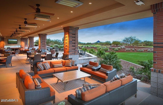 view of patio / terrace featuring ceiling fan, outdoor lounge area, and outdoor dining space