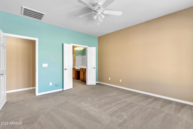 unfurnished bedroom featuring light carpet, a ceiling fan, visible vents, and baseboards