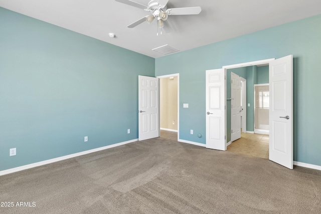 unfurnished bedroom with a ceiling fan, carpet, visible vents, and baseboards