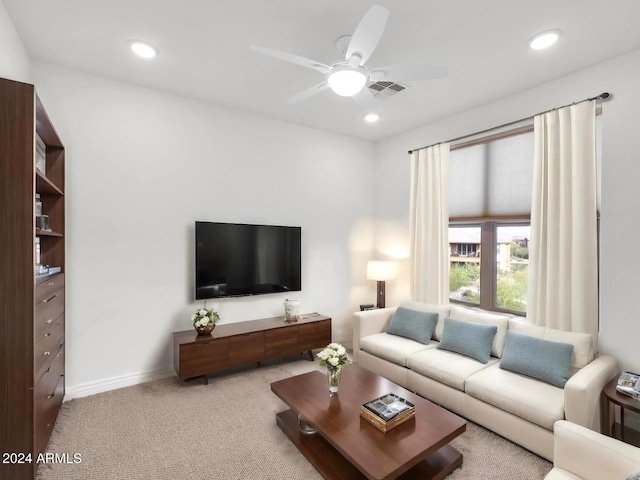 living room with ceiling fan and light carpet