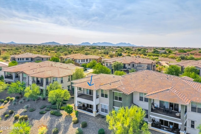 birds eye view of property featuring a mountain view