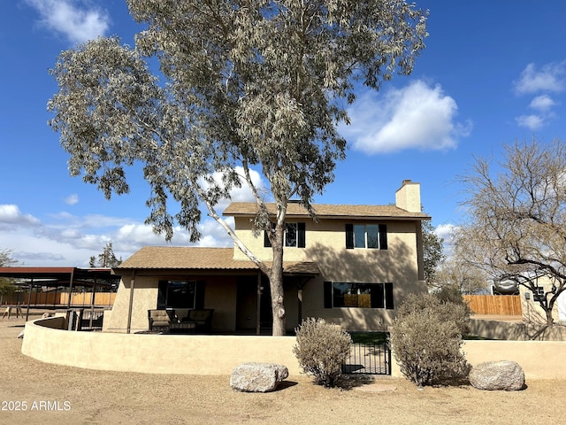 rear view of house featuring a patio area