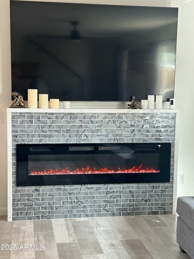 interior details featuring a brick fireplace