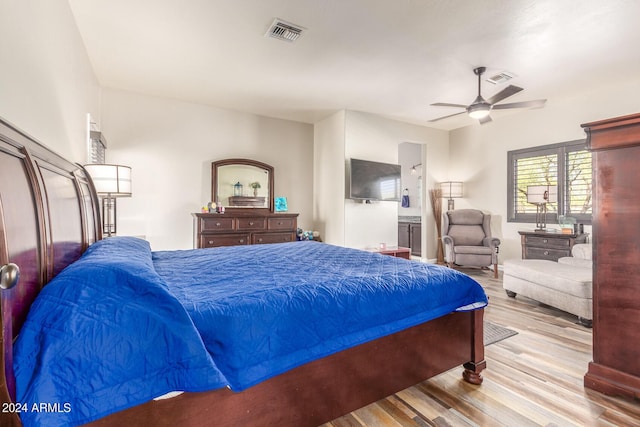 36382 N 35th St, Cave Creek, AZ 85331 - bedroom with ensuite bath, wood finished floors, visible vents, and ceiling fan