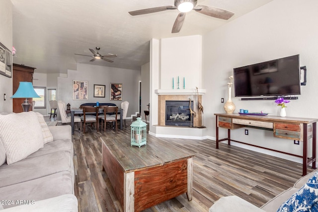 36382 N 35th St, Cave Creek, AZ 85331 - living room with a glass covered fireplace, wood finished floors, a ceiling fan, and baseboards