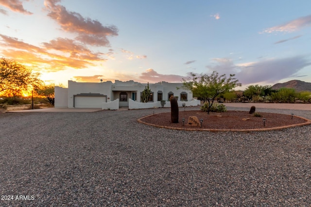 36382 N 35th St, Cave Creek, AZ 85331 - view of front of home with a garage, stucco siding, and curved driveway