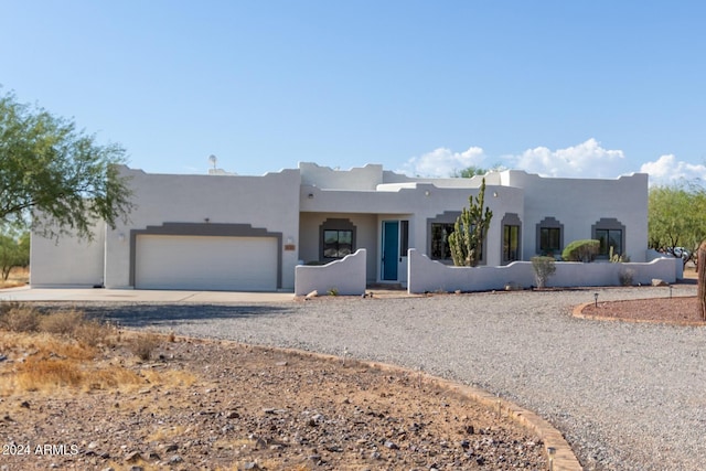 36382 N 35th St, Cave Creek, AZ 85331 - adobe home with stucco siding, driveway, and a garage