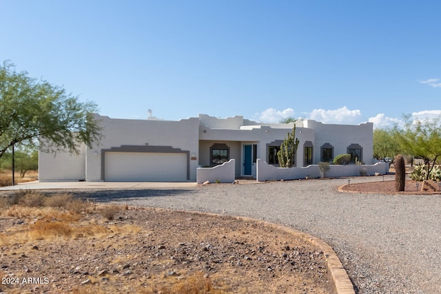 adobe home featuring a garage