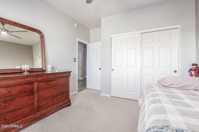 carpeted bedroom with a closet and ceiling fan