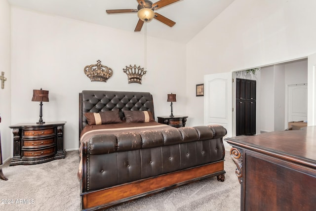 bedroom with high vaulted ceiling, ceiling fan, and light carpet