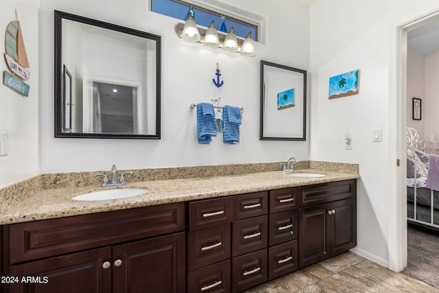 bathroom with tile patterned flooring and vanity