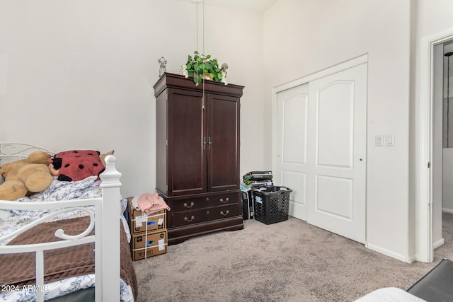 bedroom with light colored carpet