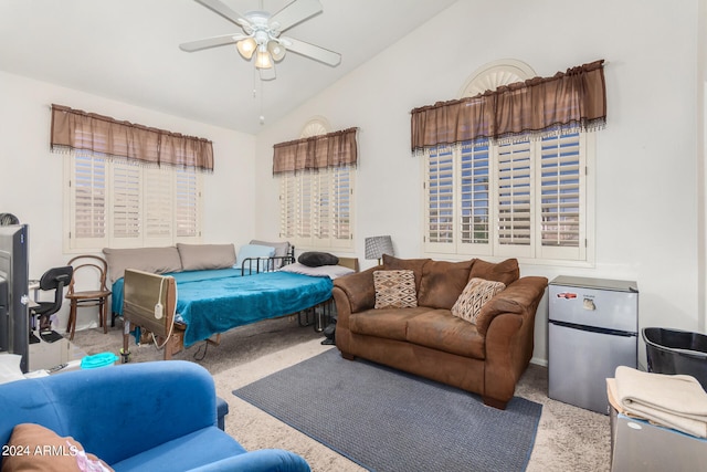 bedroom featuring light colored carpet, stainless steel fridge, lofted ceiling, and ceiling fan