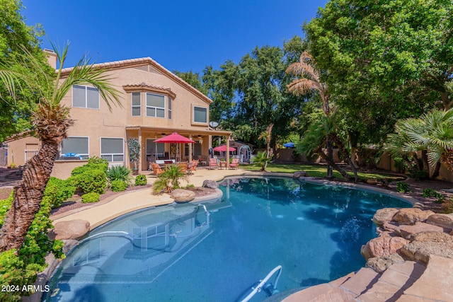 view of pool featuring a patio area