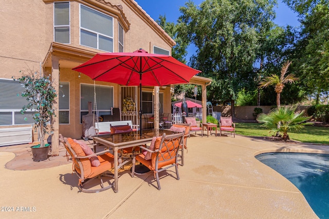 view of patio featuring a swimming pool