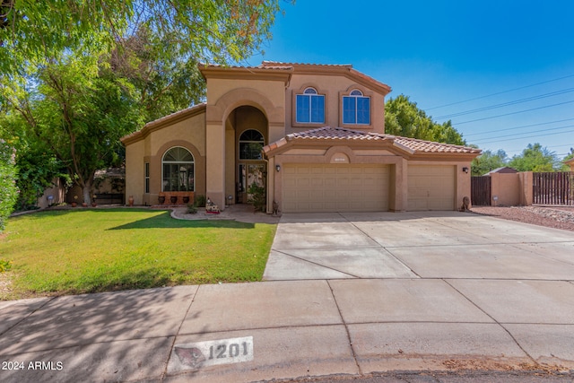 mediterranean / spanish home with a front yard