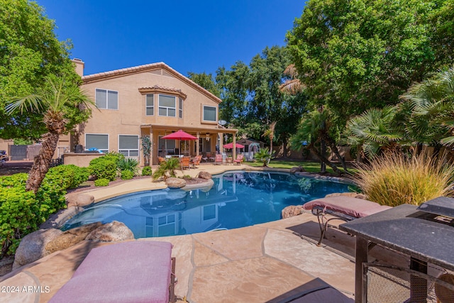 view of swimming pool featuring a patio area