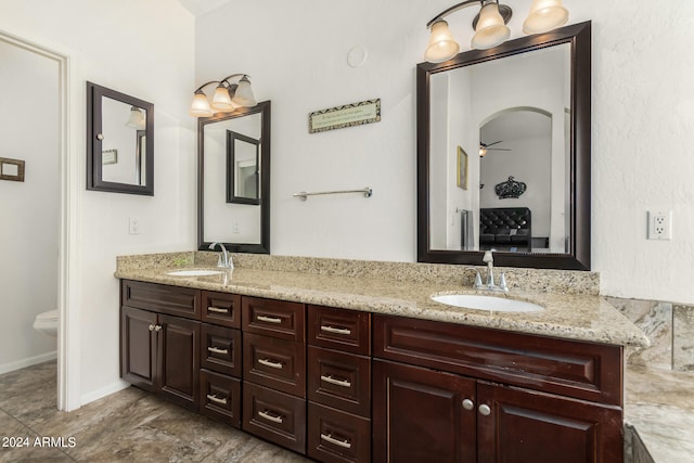 bathroom with toilet and vanity