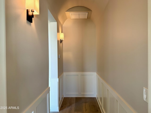 3021 N 47th St, Phoenix, AZ 85018 - hall featuring wainscoting, a decorative wall, dark wood-type flooring, and an upstairs landing