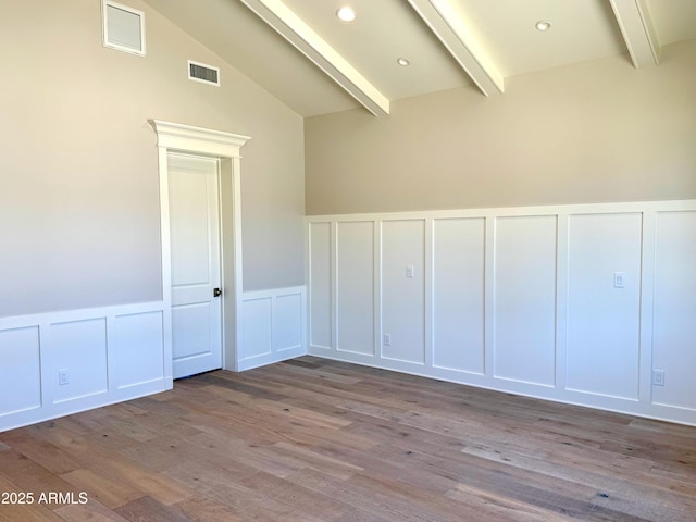 3021 N 47th St, Phoenix, AZ 85018 - spare room with a decorative wall, wood finished floors, wainscoting, and recessed lighting