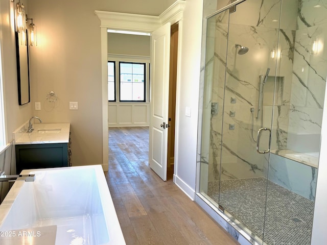 3021 N 47th St, Phoenix, AZ 85018 - full bath with wood finished floors, vanity, a marble finish shower, and a tub to relax in