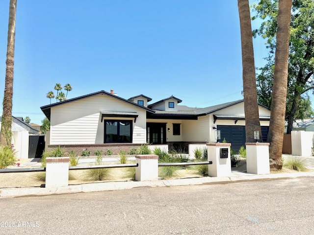 3021 N 47th St, Phoenix, AZ 85018 - view of front of house featuring a fenced front yard and an attached garage