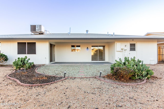 back of house with a patio area and central air condition unit