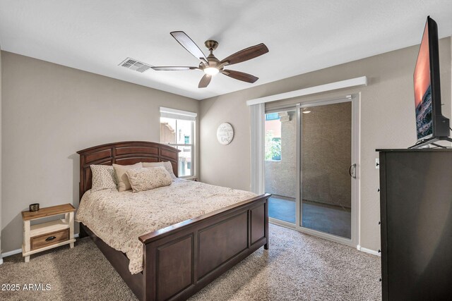 2049 N 77th Dr, Phoenix, AZ 85035 - carpeted bedroom with baseboards, access to outside, a ceiling fan, and visible vents