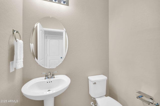 2049 N 77th Dr, Phoenix, AZ 85035 - half bath with a sink and toilet