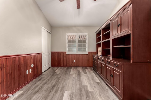 unfurnished office featuring ceiling fan and light wood-type flooring