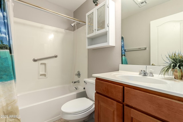 full bathroom with vanity, shower / bath combination with curtain, and toilet