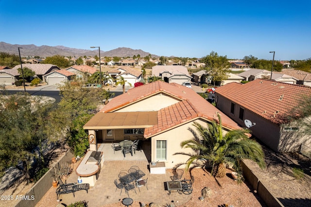 birds eye view of property with a mountain view