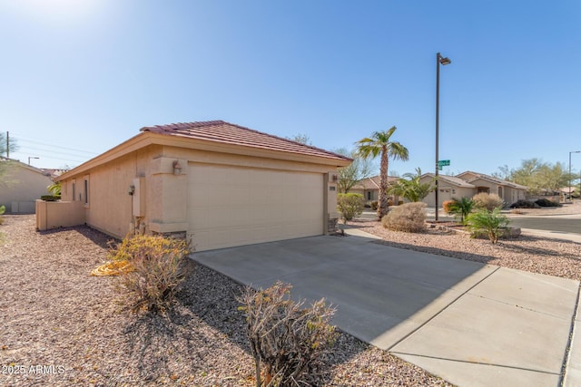 view of side of home featuring a garage