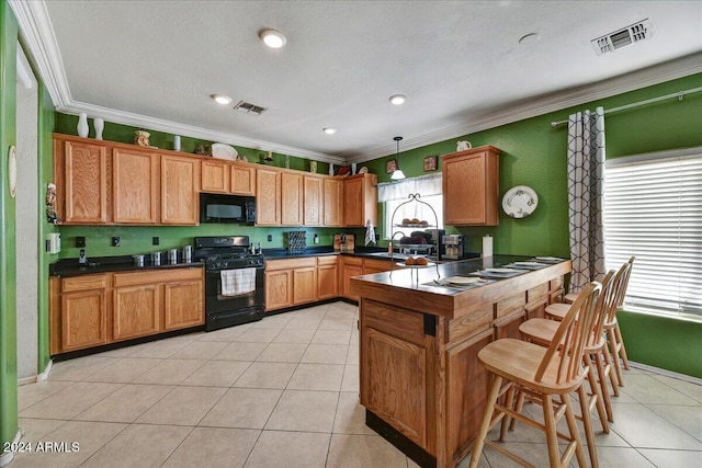 kitchen featuring decorative light fixtures, a wealth of natural light, crown molding, and black appliances