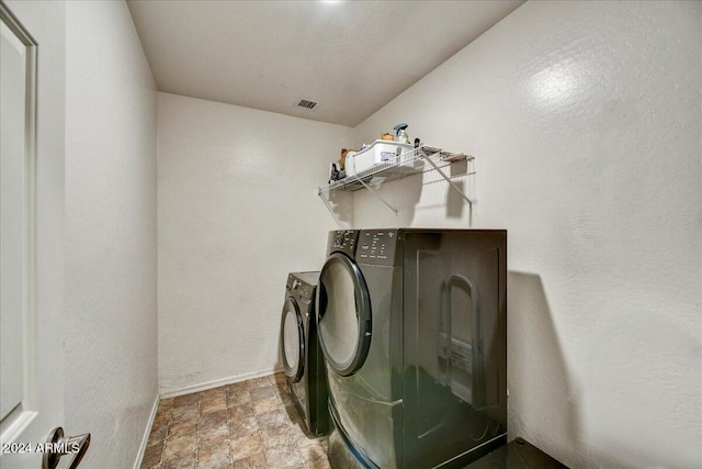 washroom featuring separate washer and dryer