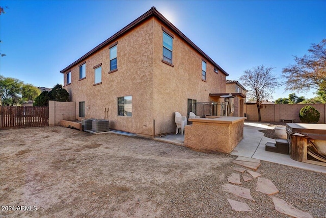 back of house featuring a patio area