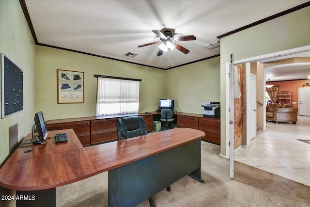 carpeted home office with a textured ceiling, ceiling fan, and crown molding