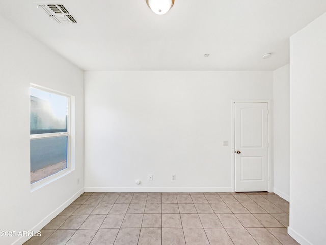 empty room featuring light tile patterned floors